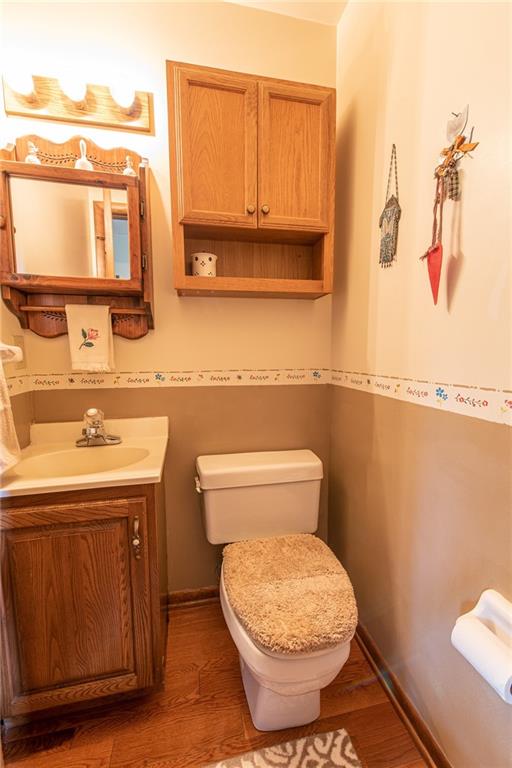 1453 Airport Road Vandergrift, PA 15690 - Photo 17 of 48 a bathroom with a toilet a sink and mirror