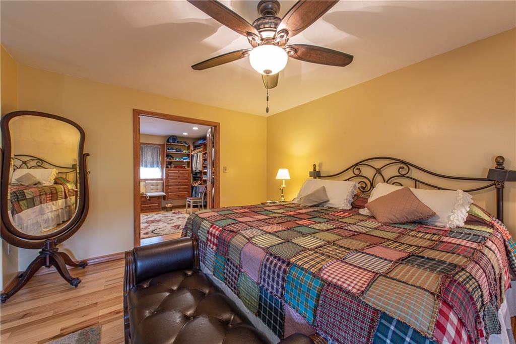 1453 Airport Road Vandergrift, PA 15690 - Photo 19 of 48 a bedroom with a bed and a chandelier