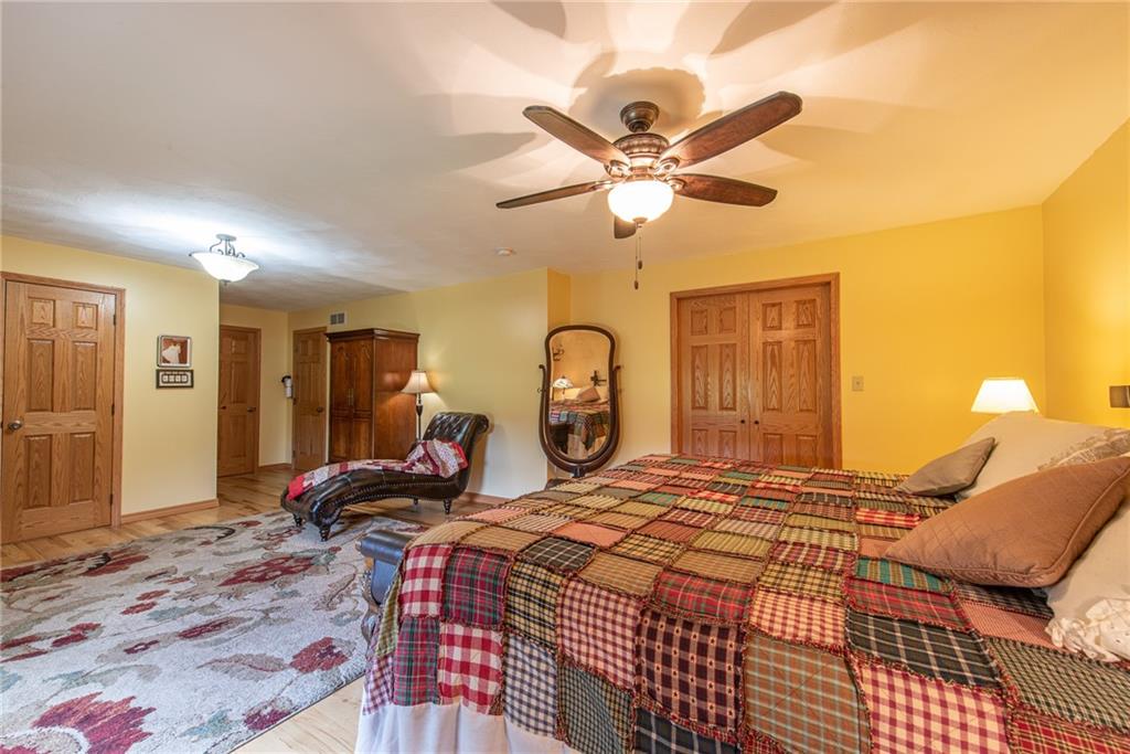 1453 Airport Road Vandergrift, PA 15690 - Photo 20 of 48 a bedroom with a bed and a chandelier