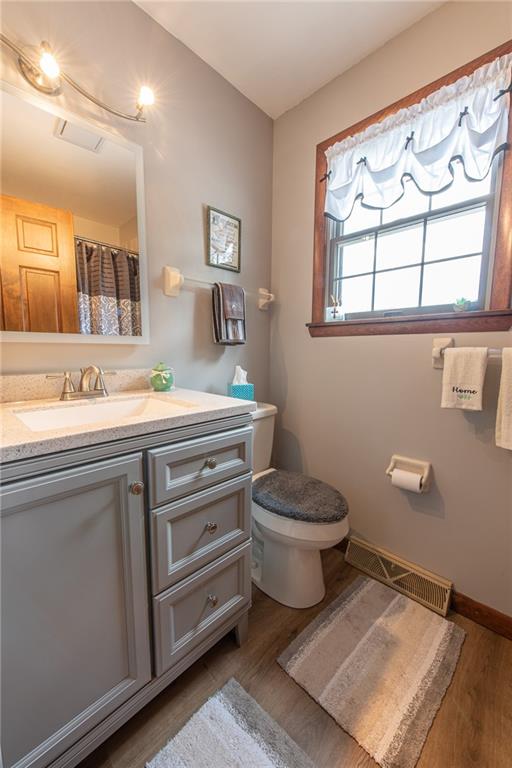 1453 Airport Road Vandergrift, PA 15690 - Photo 31 of 48 a bathroom with a toilet sink and mirror