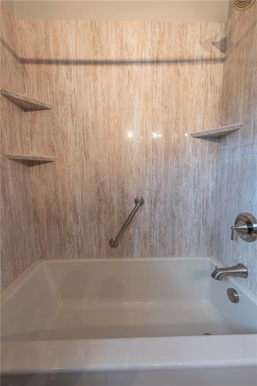 1453 Airport Road Vandergrift, PA 15690 - Photo 32 of 48 a bathroom with a bathtub and a shower
