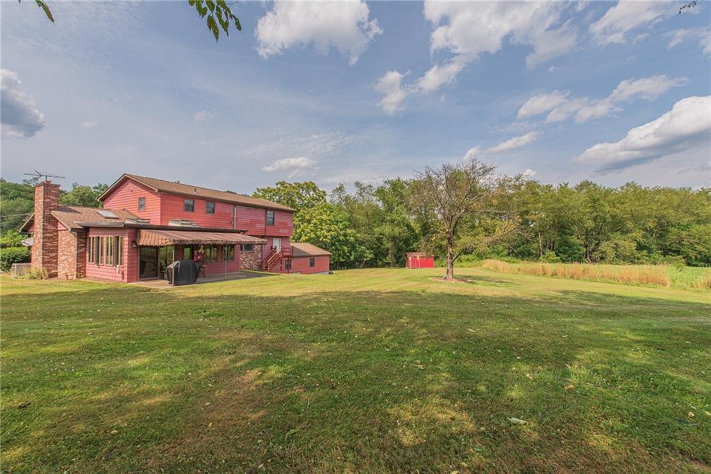 1453 Airport Road Vandergrift, PA 15690 - Photo 42 of 48 a view of a house with a big yard