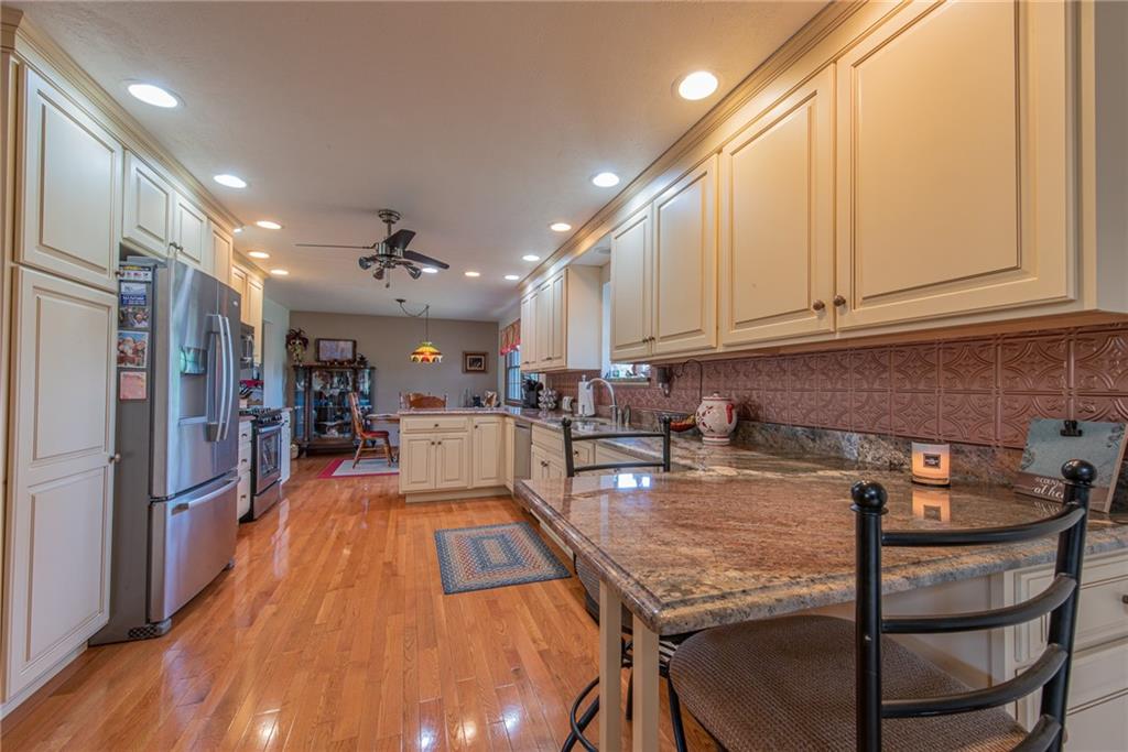 1453 Airport Road Vandergrift, PA 15690 - Photo 7 of 48 a kitchen with stainless steel appliances granite countertop a refrigerator and microwave