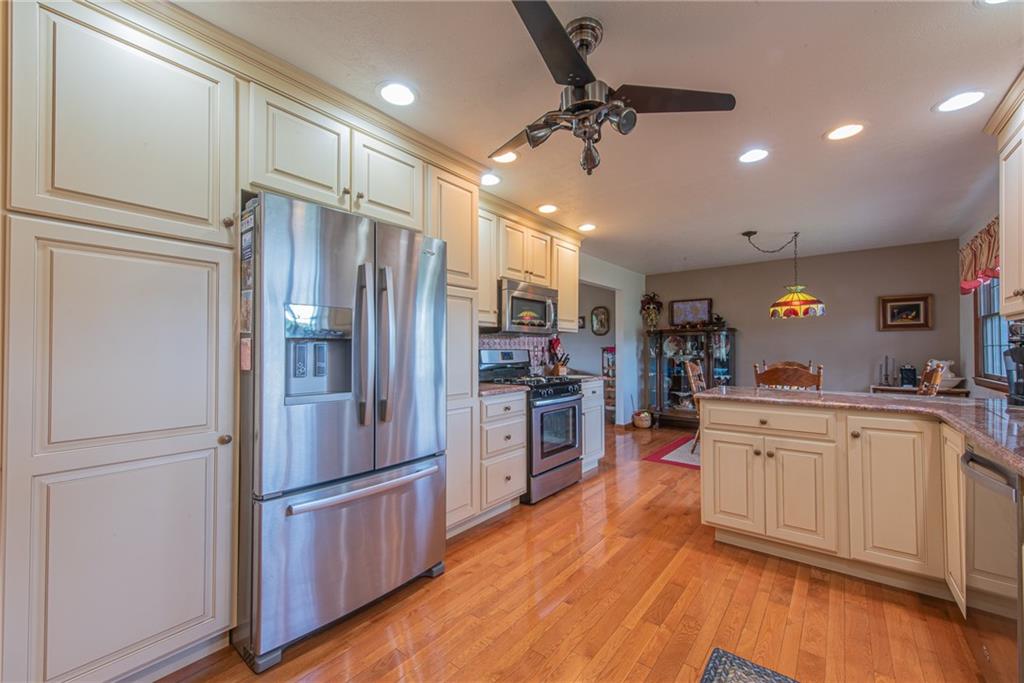 1453 Airport Road Vandergrift, PA 15690 - Photo 8 of 48 a kitchen with stainless steel appliances granite countertop a refrigerator a stove and a sink