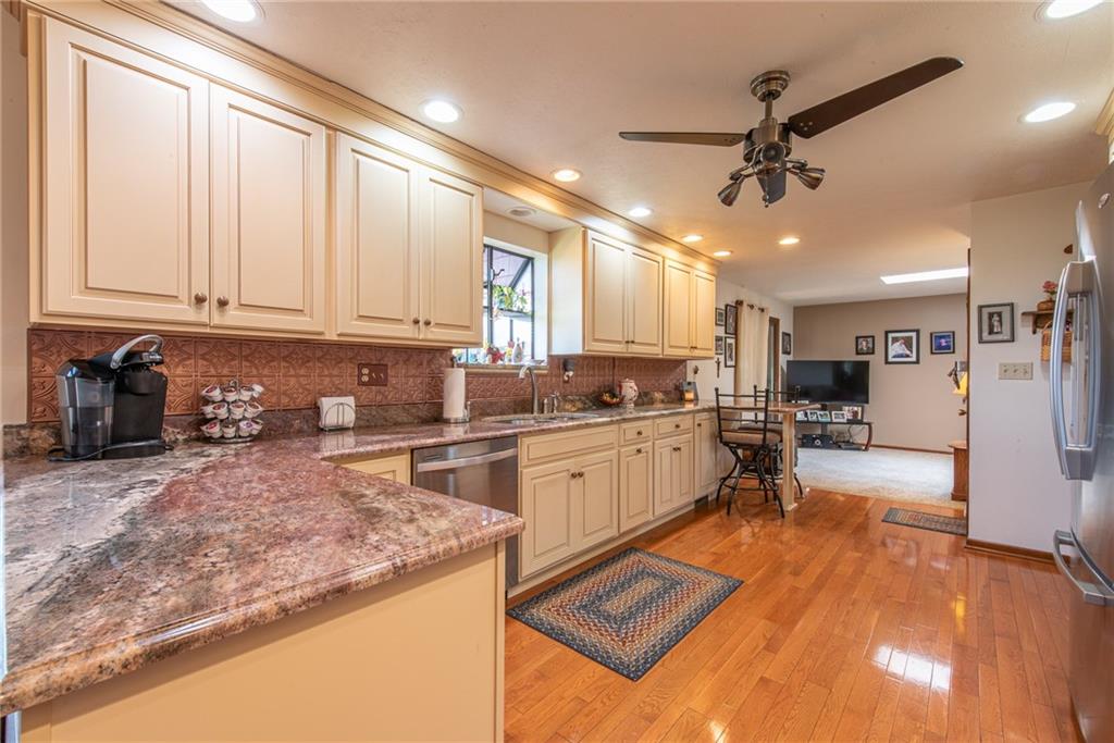 1453 Airport Road Vandergrift, PA 15690 - Photo 9 of 48 a kitchen with stainless steel appliances granite countertop a sink stove and refrigerator