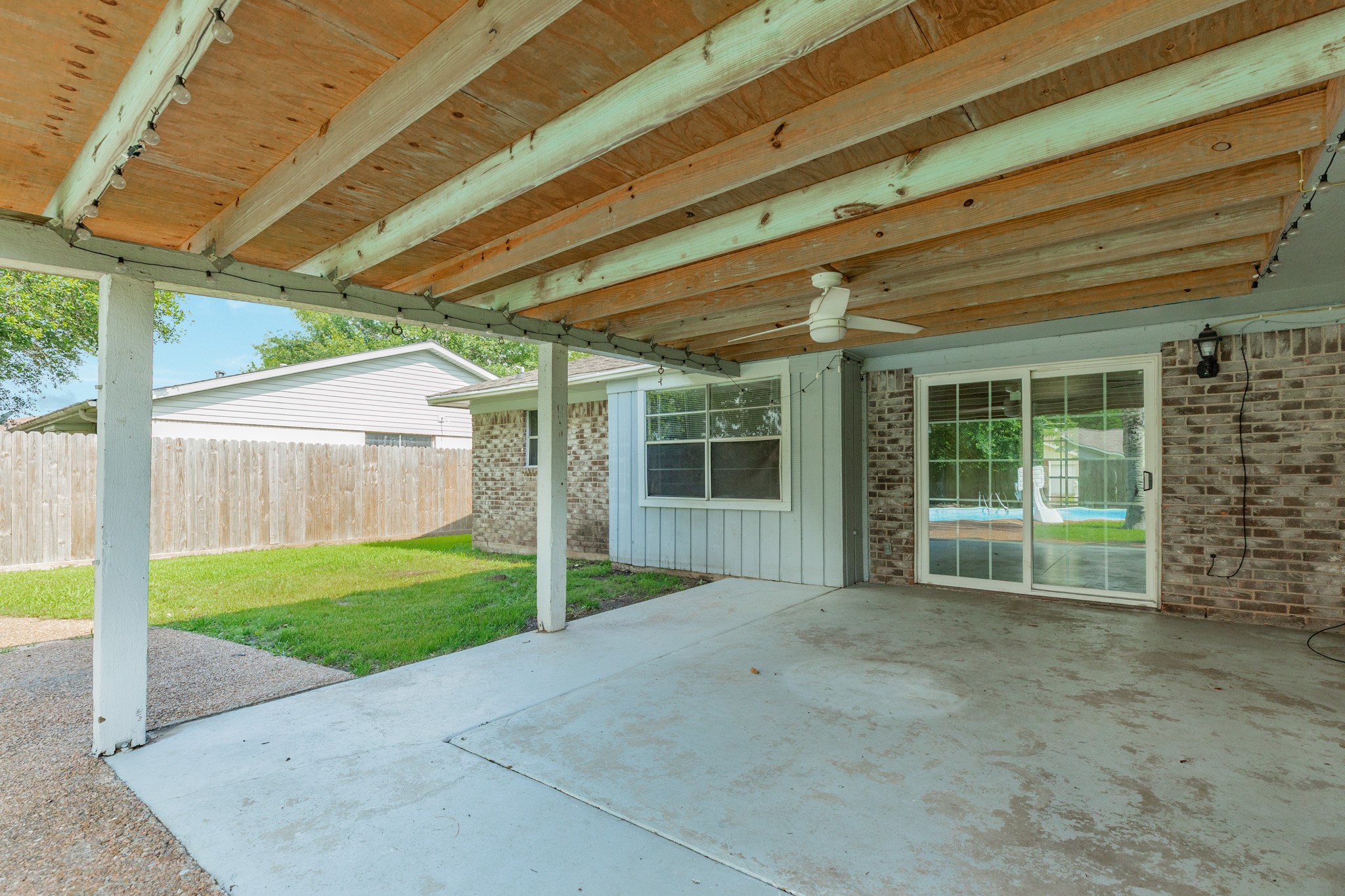 128 Houston Street Angleton, TX 77515 - Photo 7 of 25 a view of a house with backyard and porch