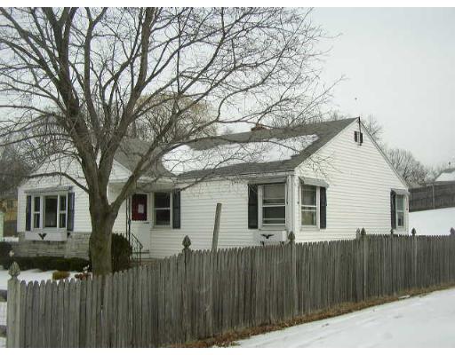 55 Tumbleweed Road Springfield, MA 01109 - Photo 1 of 1 a front view of house with a wooden fence