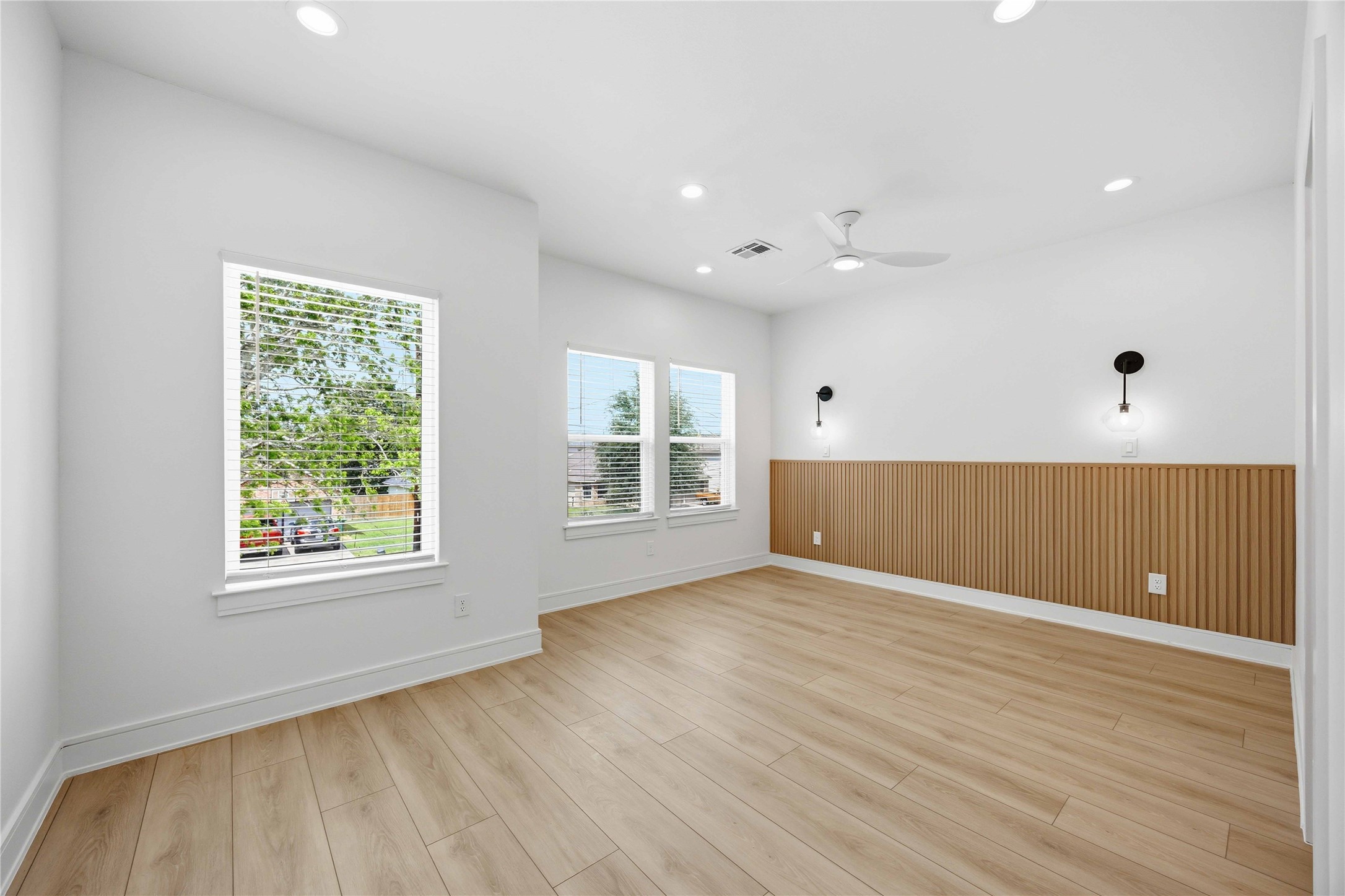 8019 Grandview Street, Unit B Houston, TX 77051 - Photo 15 of 30 a view of an empty room with wooden floor and a window