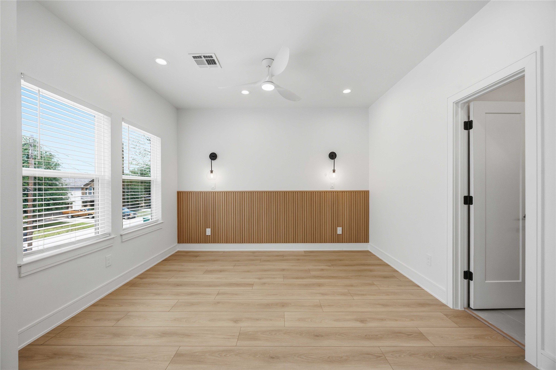 8019 Grandview Street, Unit B Houston, TX 77051 - Photo 17 of 30 a view of an empty room with wooden floor and a window