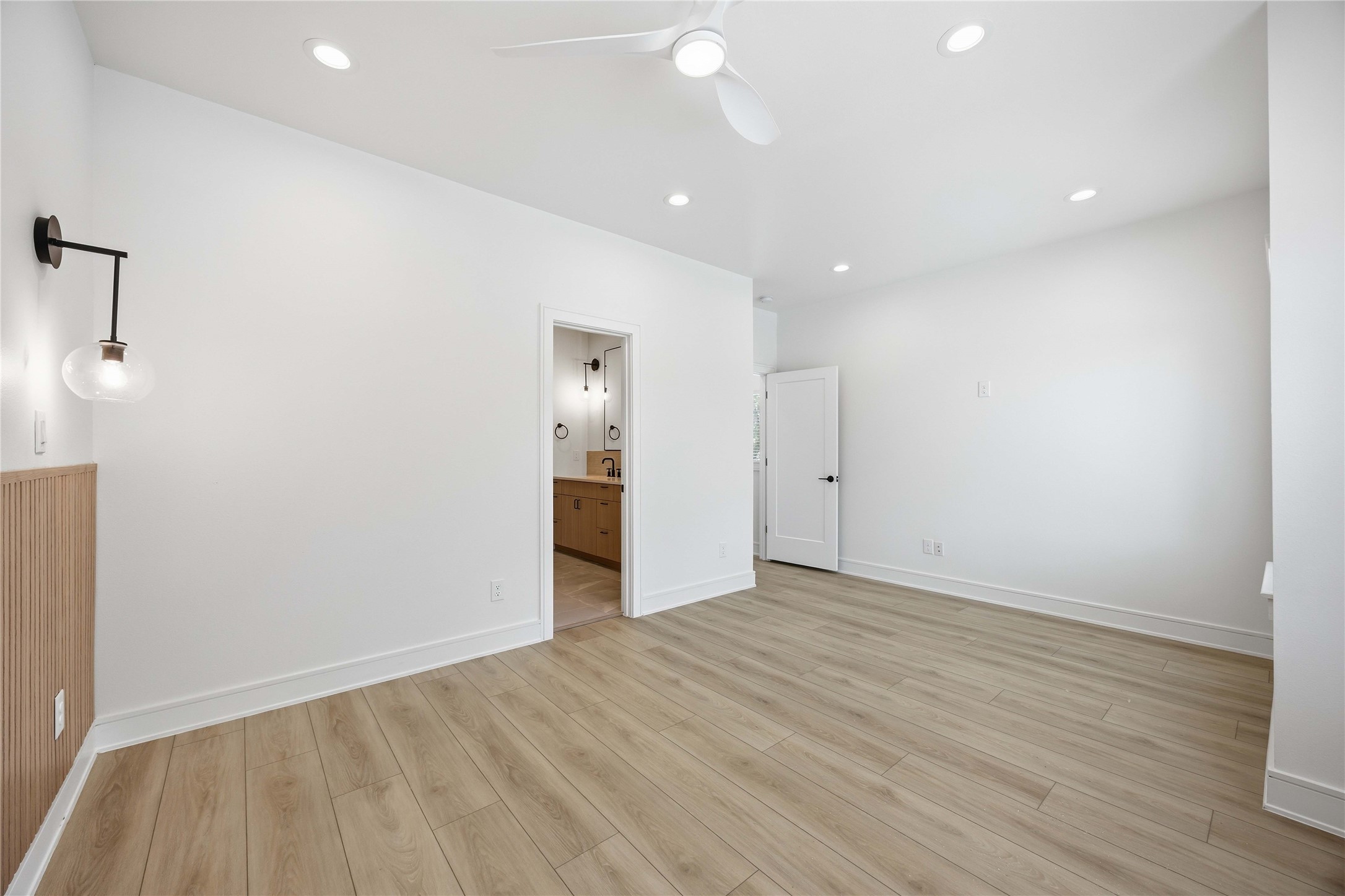 8019 Grandview Street, Unit B Houston, TX 77051 - Photo 18 of 30 a view of an empty room with wooden floor