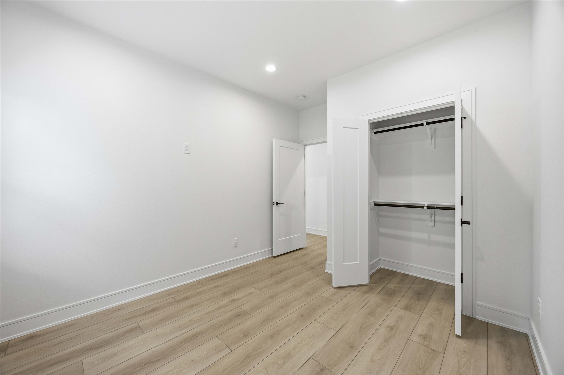 8019 Grandview Street, Unit B Houston, TX 77051 - Photo 19 of 30 an empty room with wooden floor