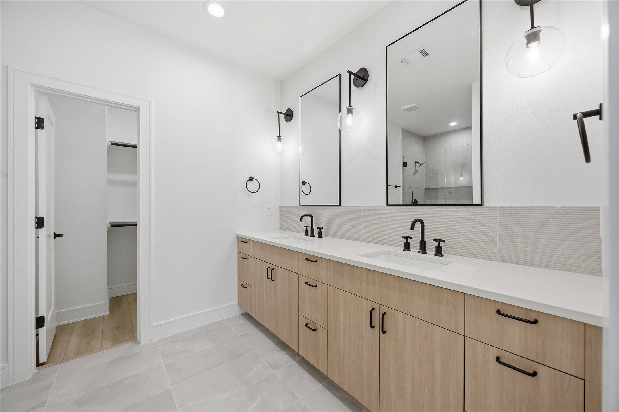 8019 Grandview Street, Unit B Houston, TX 77051 - Photo 22 of 30 a bathroom with a double vanity sink mirror and