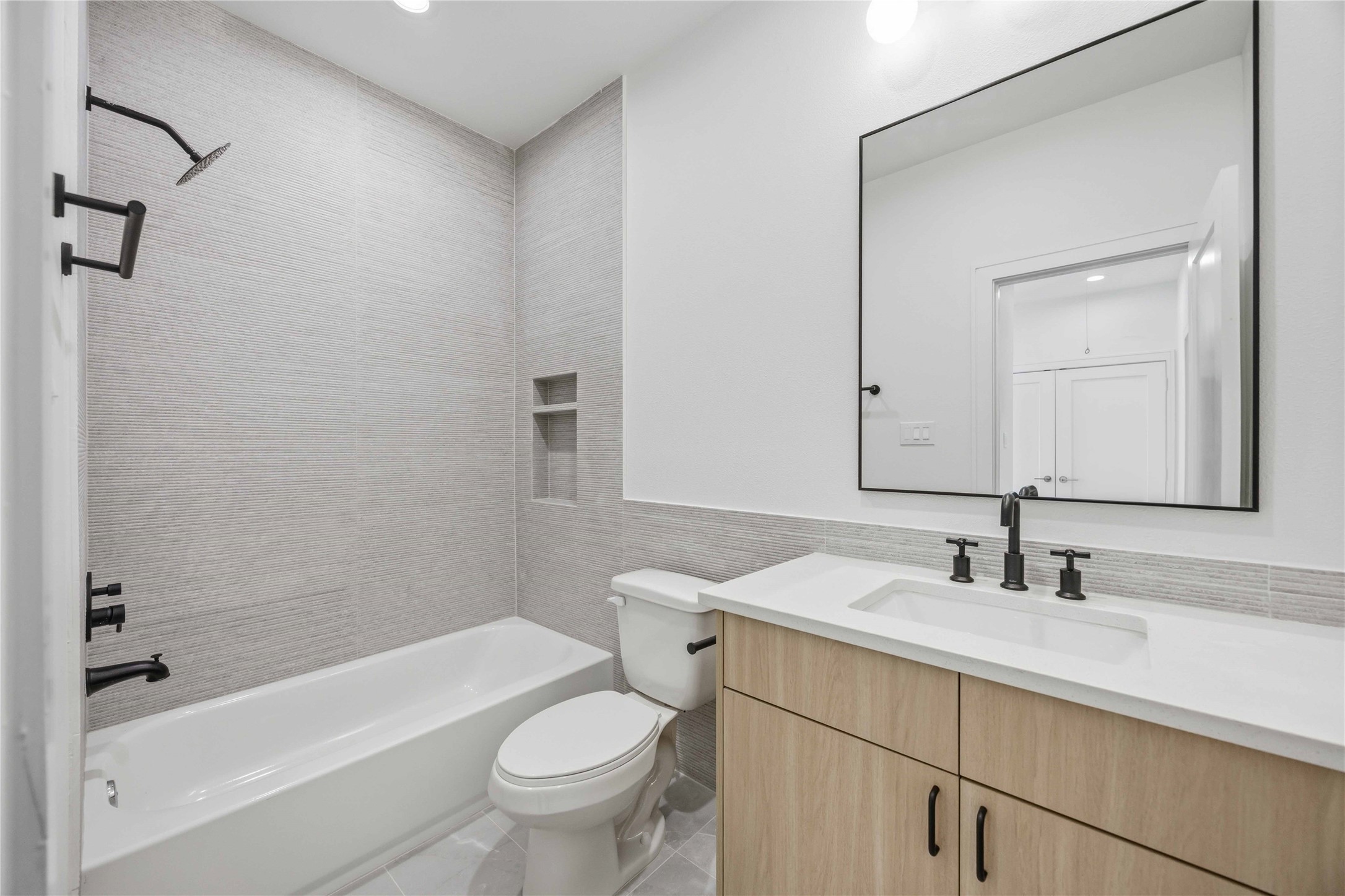 8019 Grandview Street, Unit B Houston, TX 77051 - Photo 25 of 30 a bathroom with a sink a toilet and shower