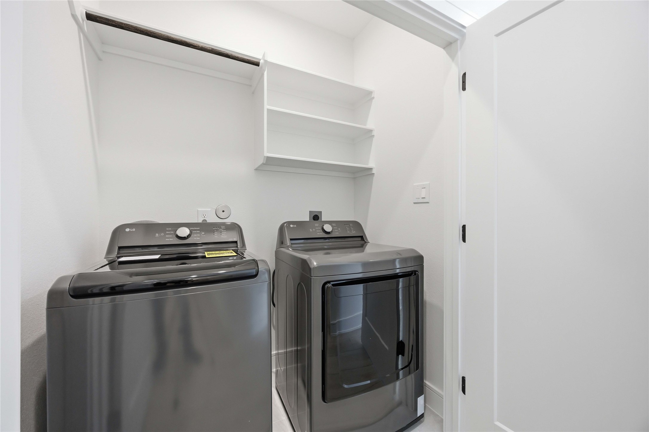 8019 Grandview Street, Unit B Houston, TX 77051 - Photo 27 of 30 a view of storage and utility room with washer and dryer