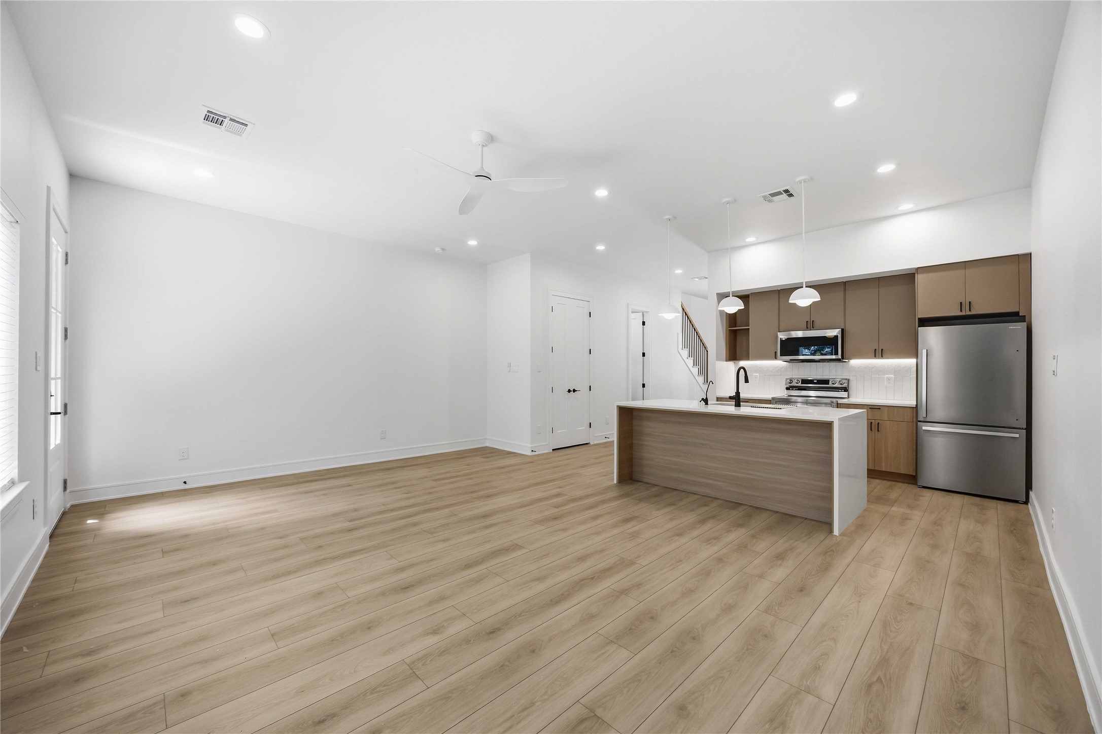 8019 Grandview Street, Unit B Houston, TX 77051 - Photo 10 of 30 a large kitchen with a lot of counter space and stainless steel appliances