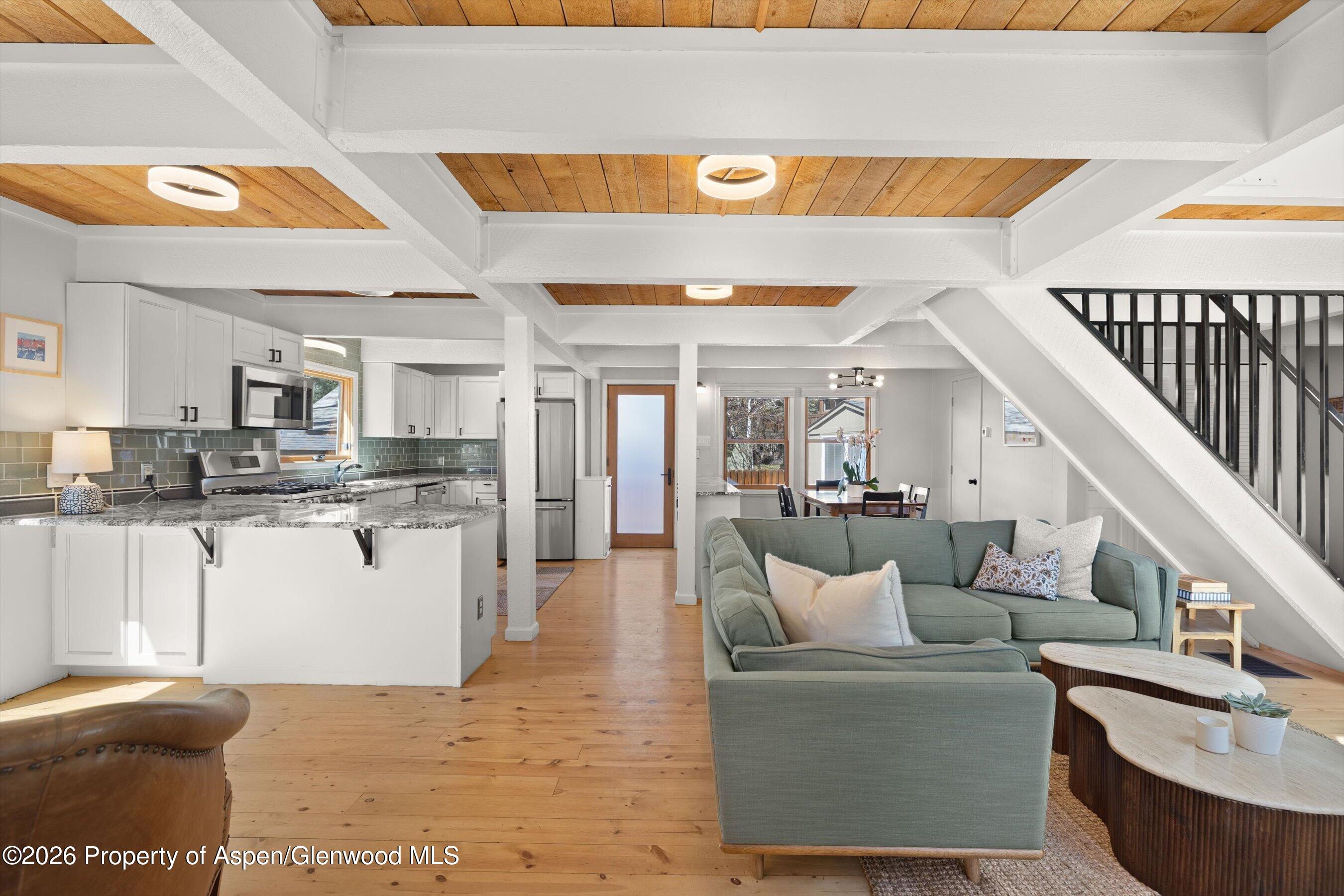 217 Longhorn Lane Basalt, CO 81621 - Photo 3 of 15 a living room with kitchen island furniture and a kitchen view