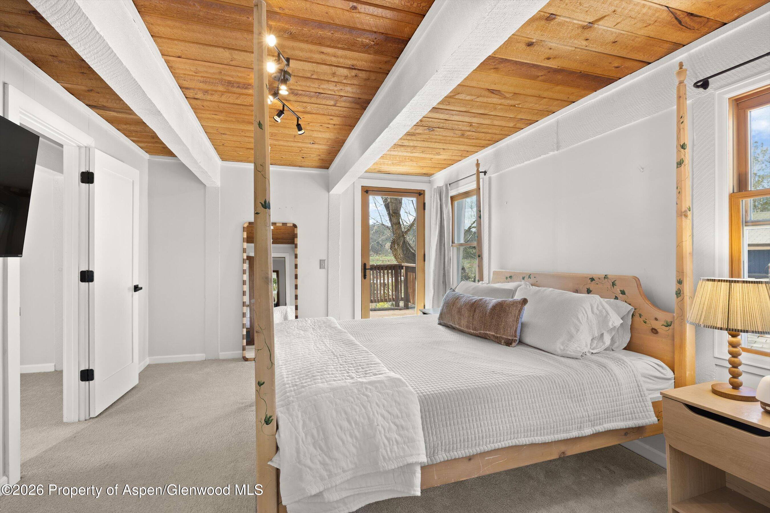 217 Longhorn Lane Basalt, CO 81621 - Photo 5 of 15 a bedroom with a bed and a large window