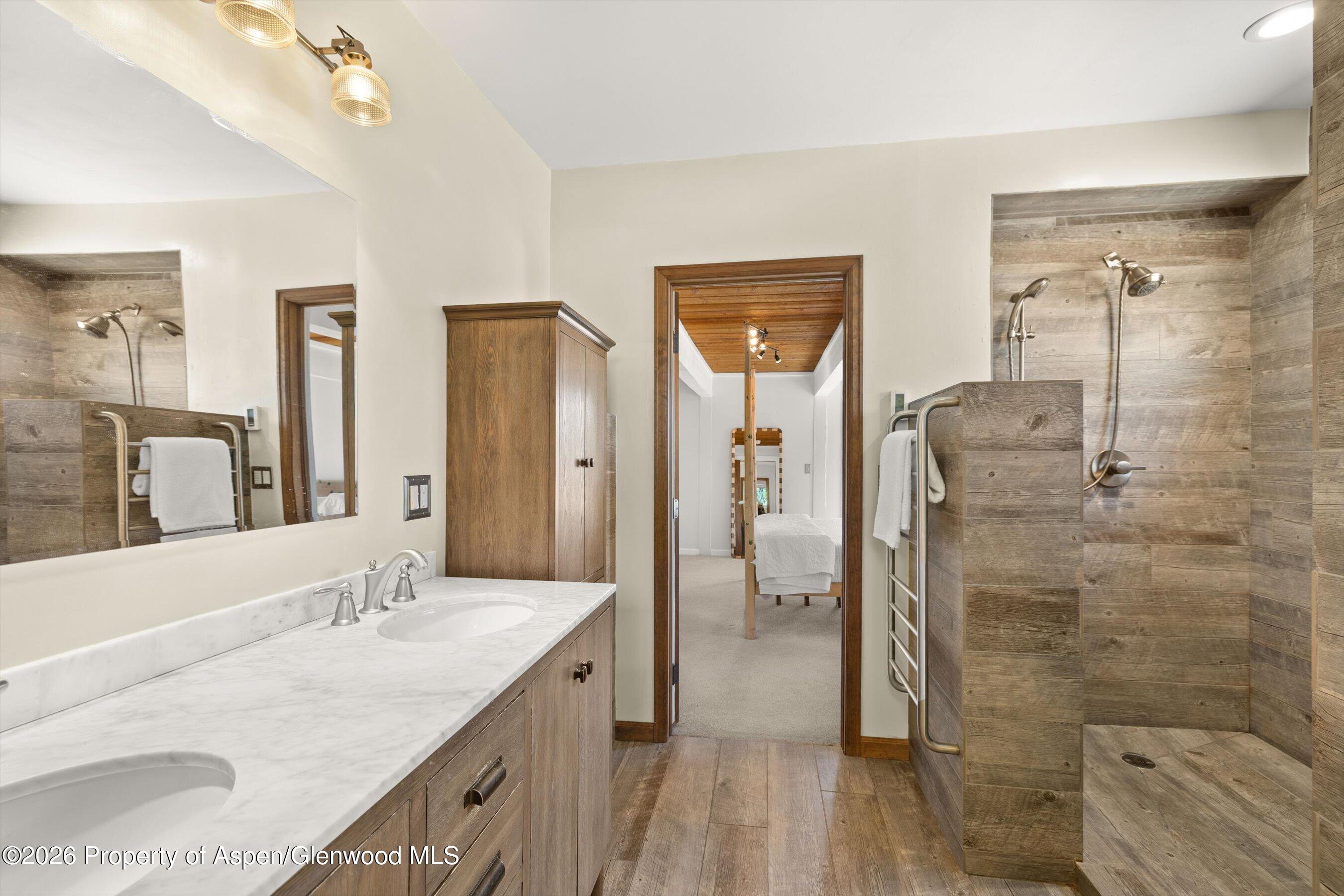 217 Longhorn Lane Basalt, CO 81621 - Photo 6 of 15 a bathroom with a granite countertop shower sink and mirror