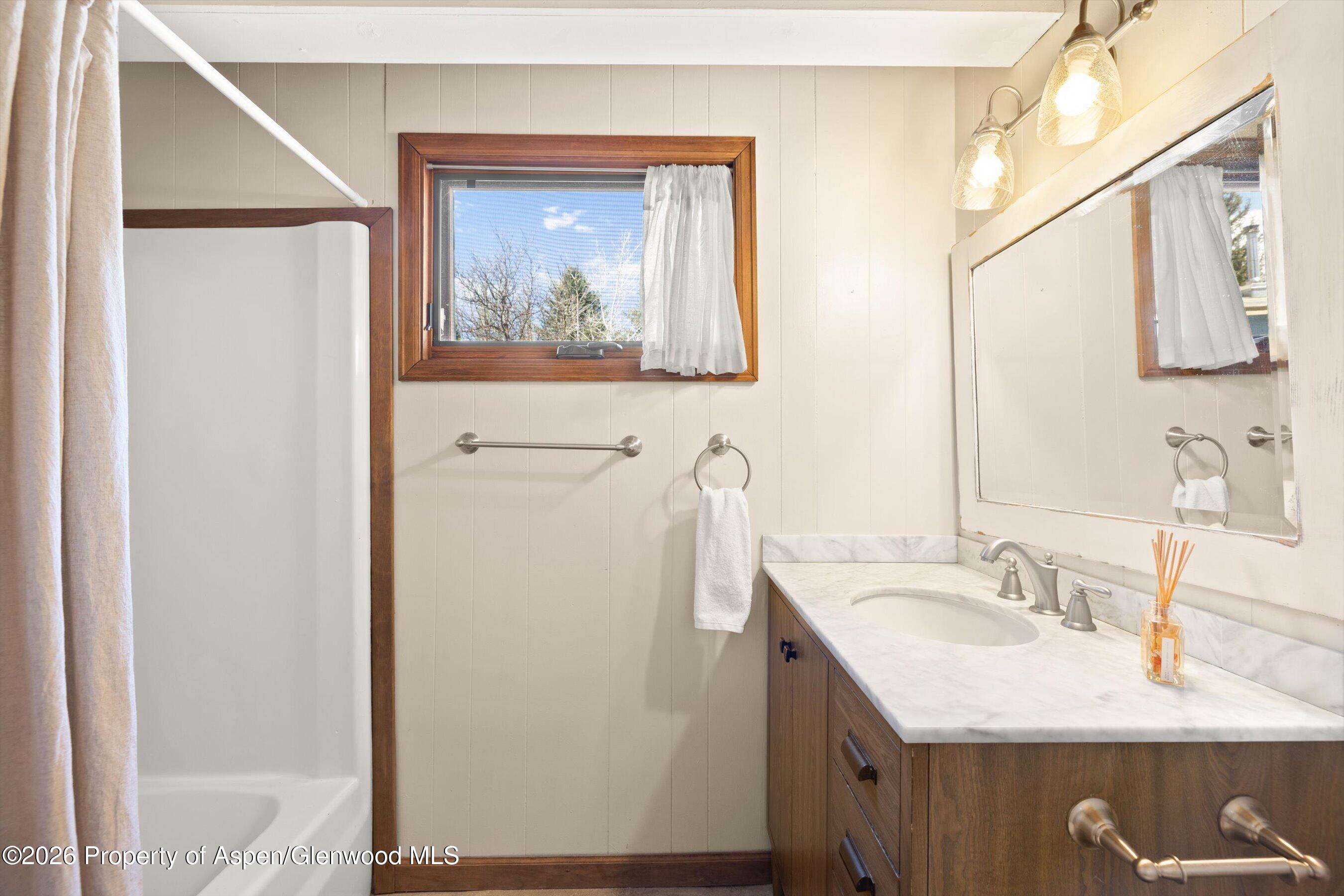 217 Longhorn Lane Basalt, CO 81621 - Photo 10 of 15 a bathroom with a granite countertop sink and a mirror