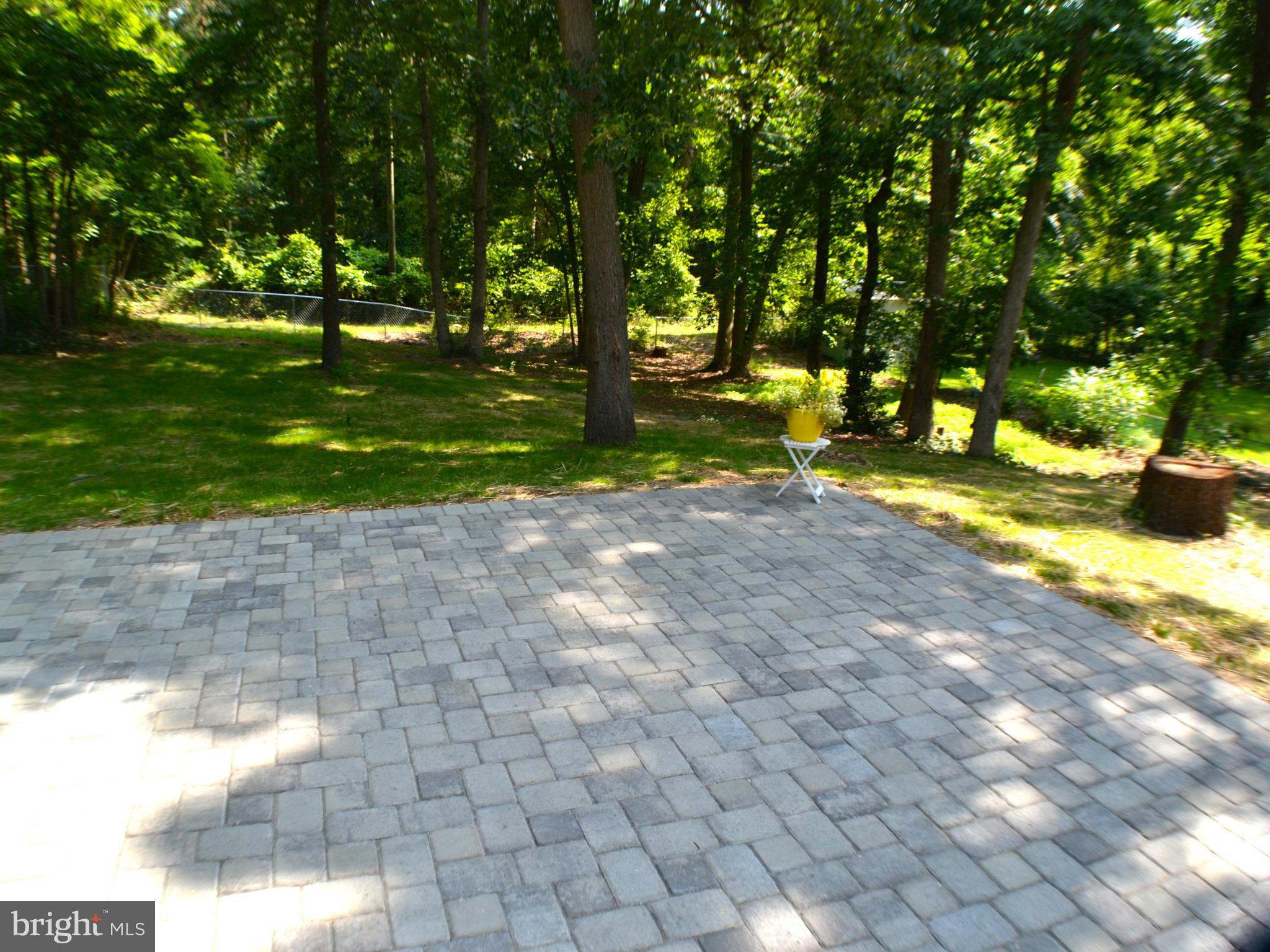 1302 Ava Road Severn, MD 21144 - Photo 26 of 30 Gorgeous Paver Patio Looking Out at Fenced Yard