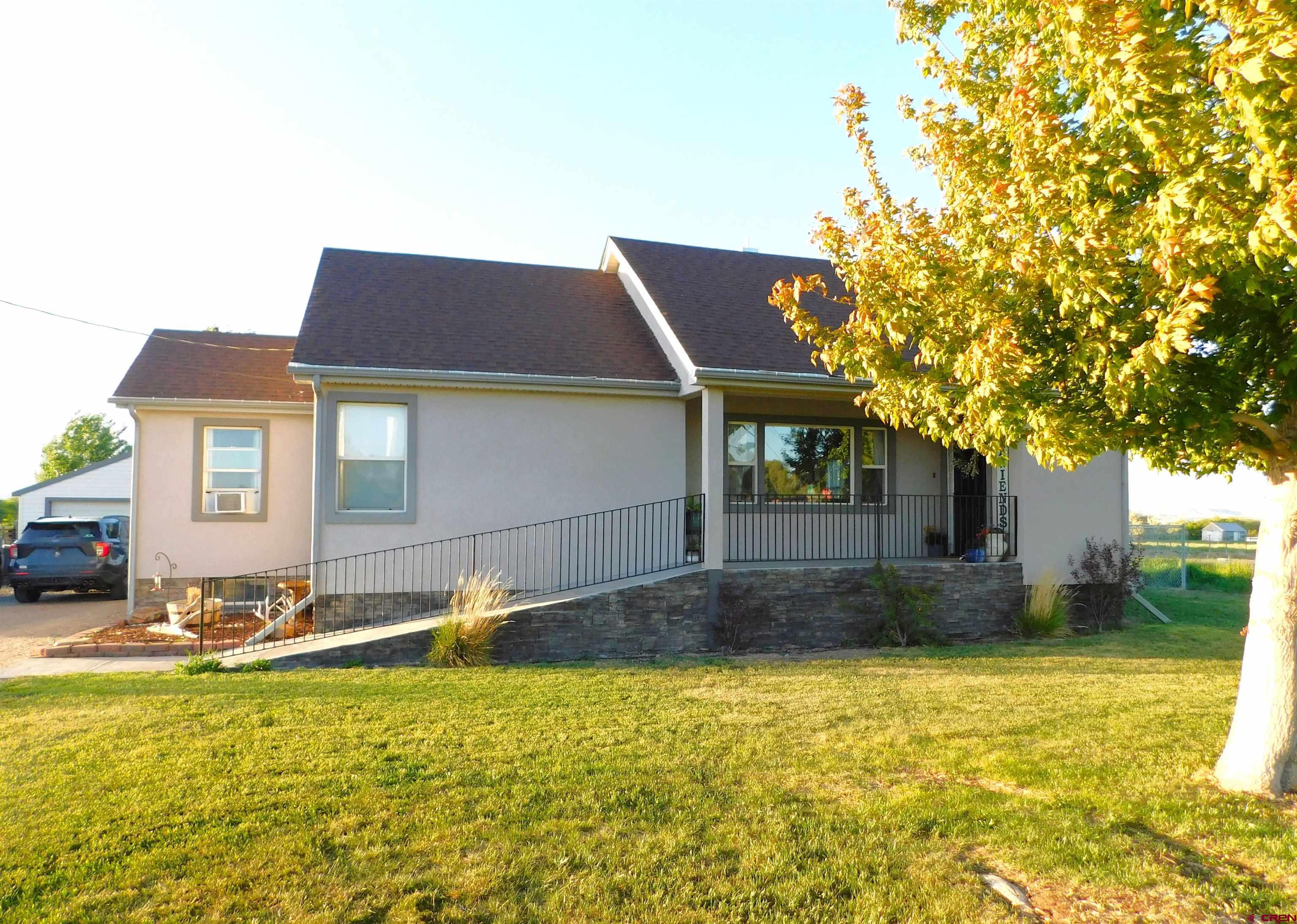 14977 F Road Delta, CO 81416 - Photo 1 of 45 a backyard of a house with table and chairs