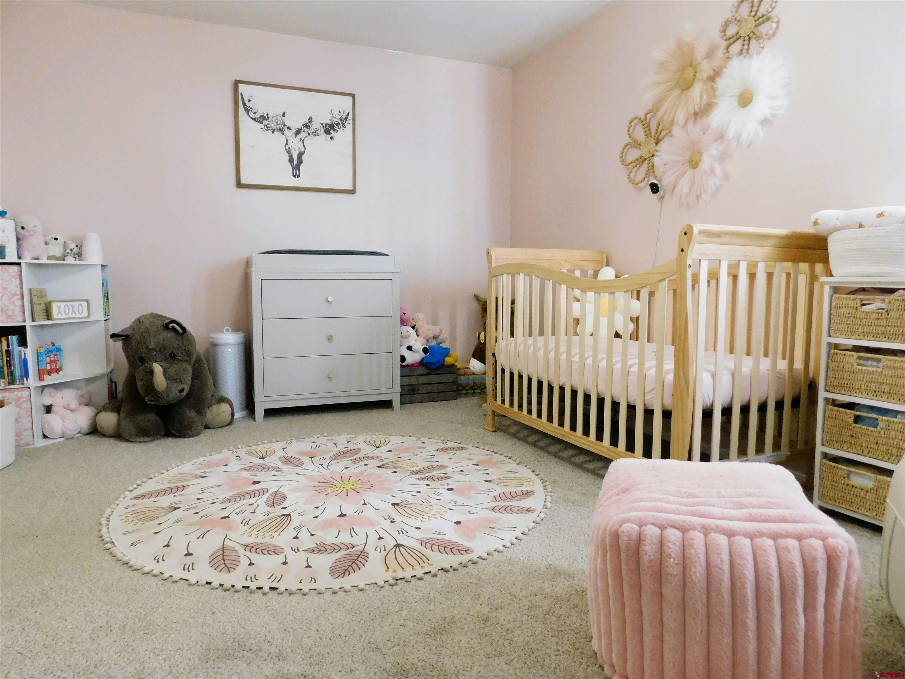 14977 F Road Delta, CO 81416 - Photo 15 of 45 a bedroom with furniture and a bed