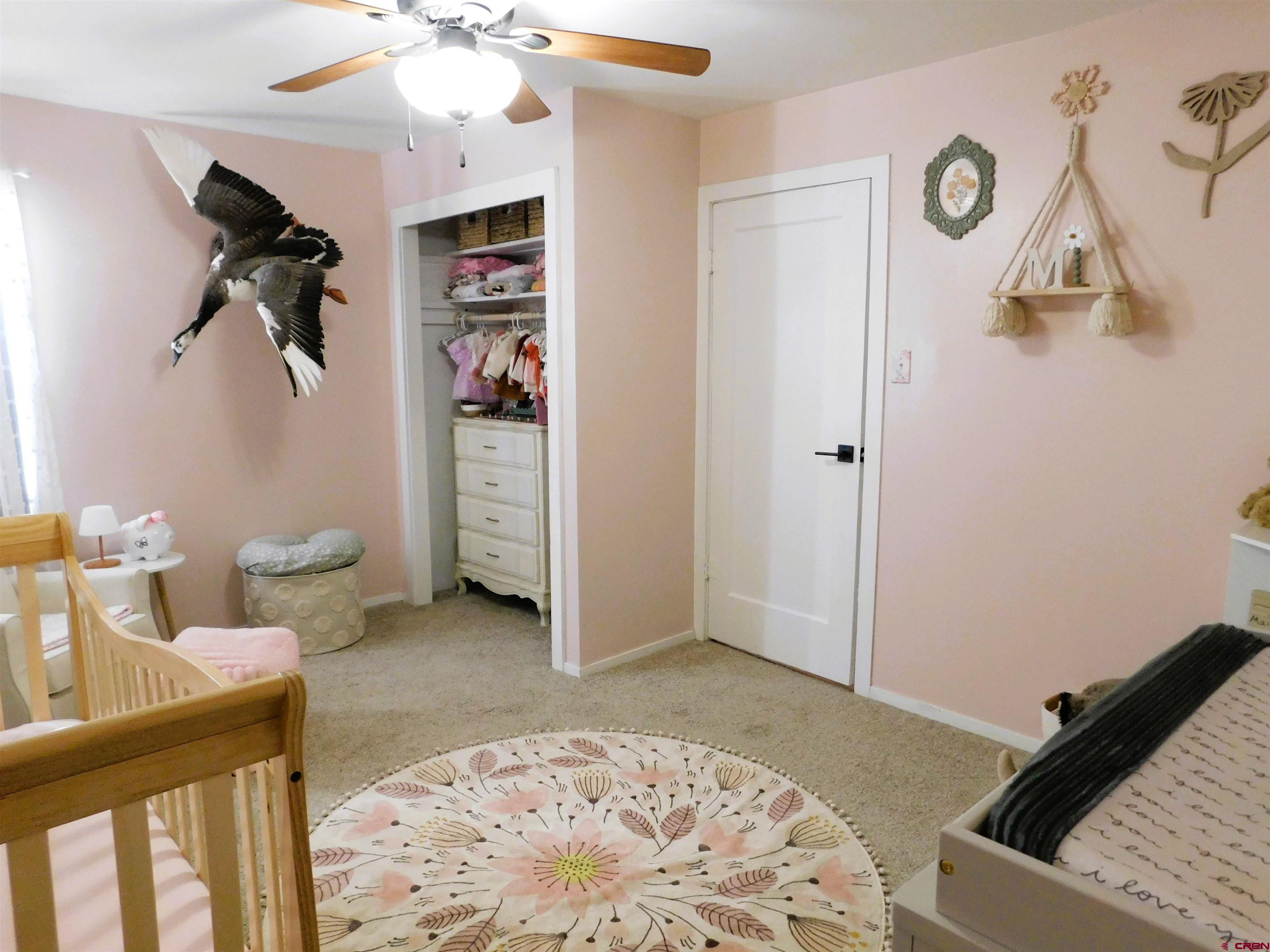 14977 F Road Delta, CO 81416 - Photo 17 of 45 a bedroom with a bed and a couch