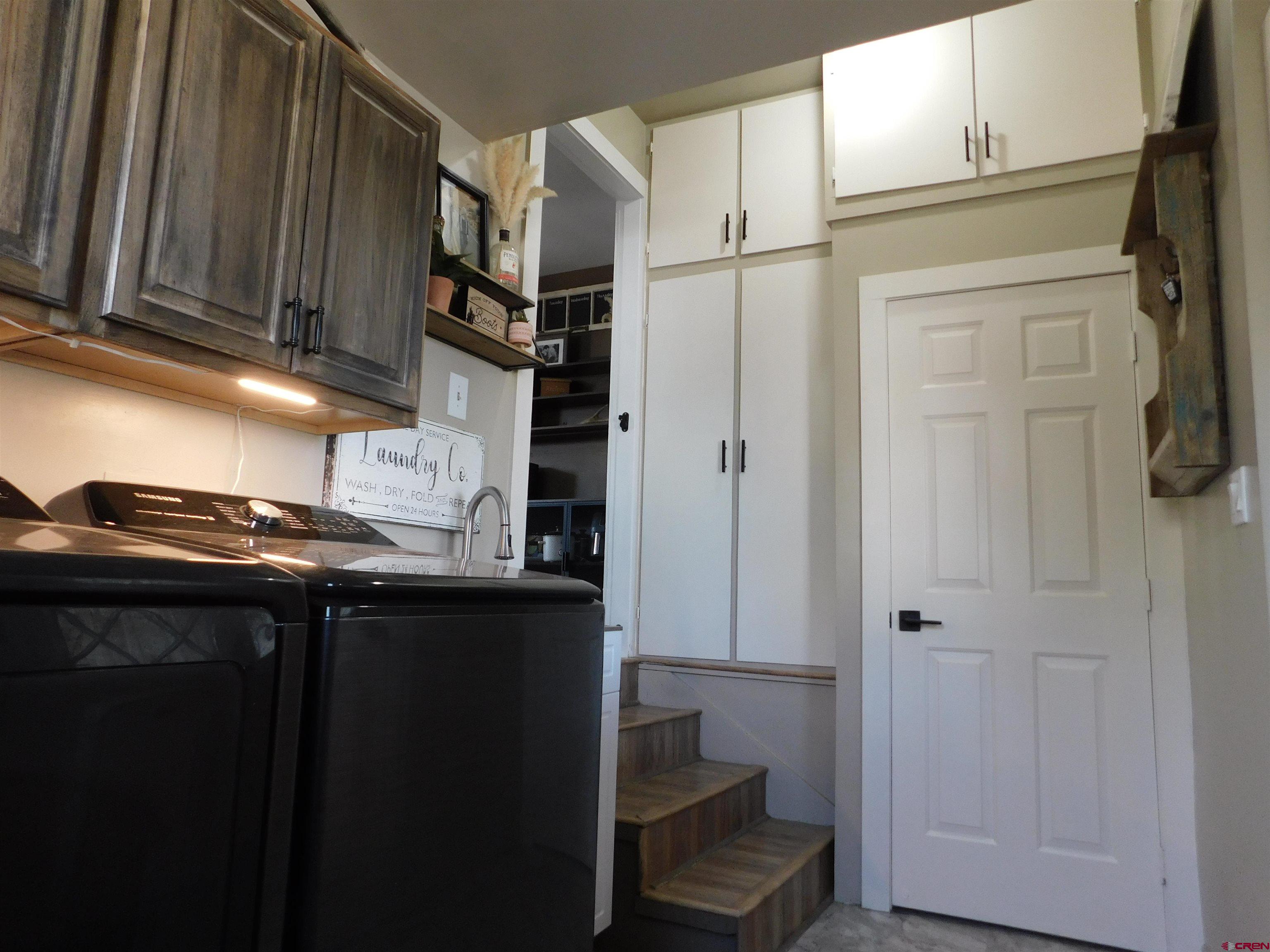14977 F Road Delta, CO 81416 - Photo 22 of 45 a kitchen with stainless steel appliances granite countertop a refrigerator and a sink