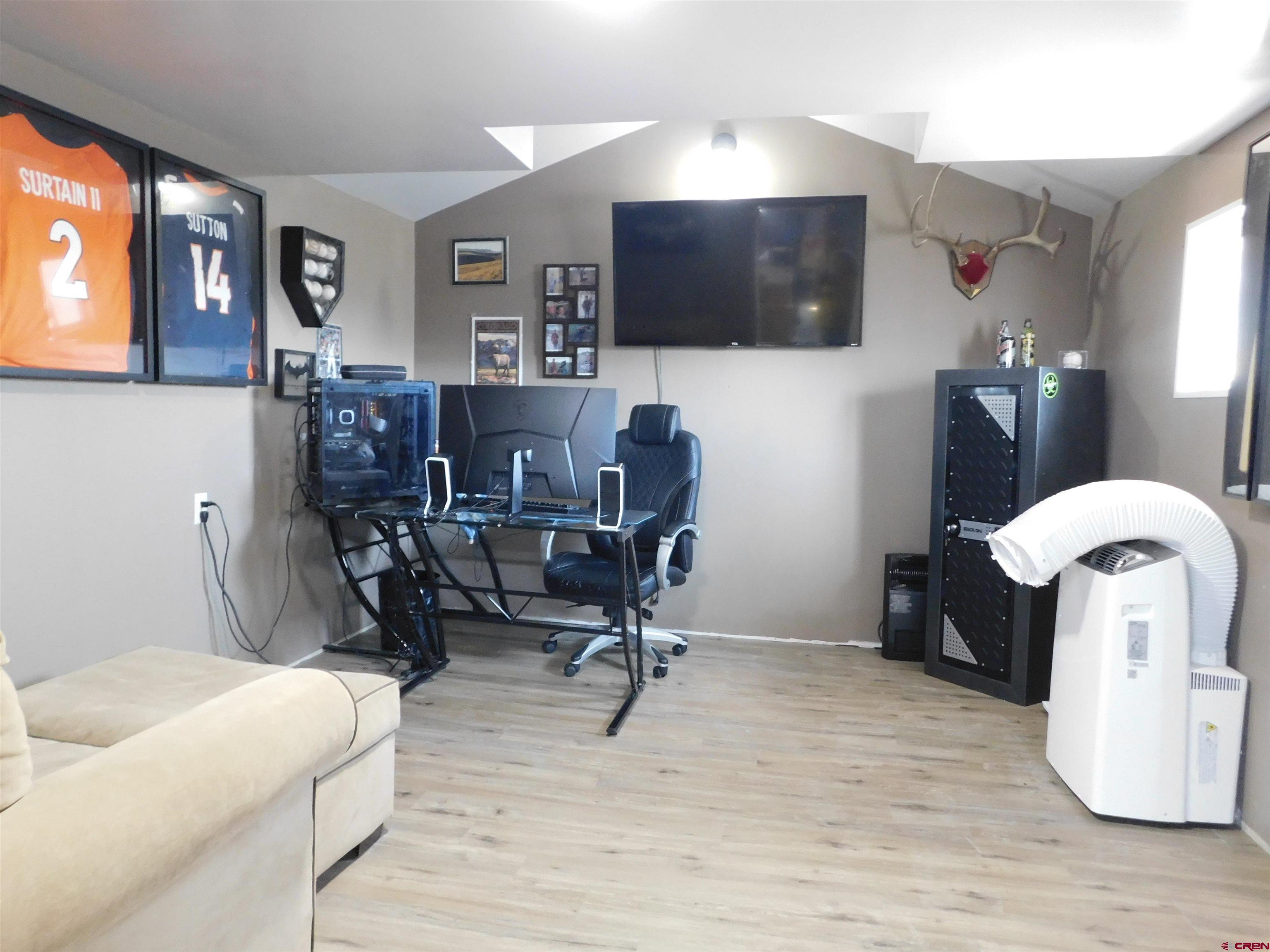 14977 F Road Delta, CO 81416 - Photo 25 of 45 a view of a livingroom with workspace and a couch