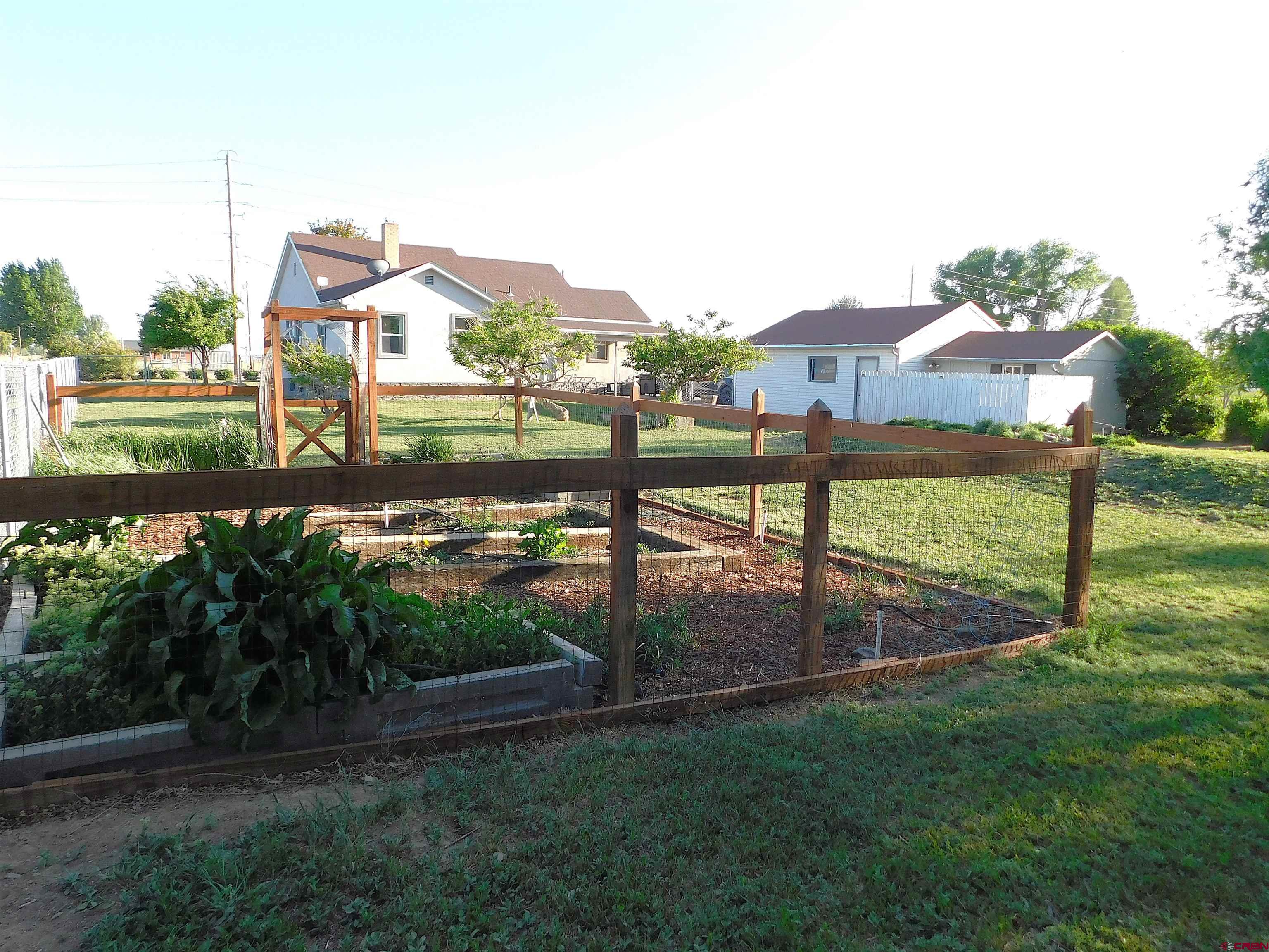 14977 F Road Delta, CO 81416 - Photo 37 of 45 a view of a lake with a yard
