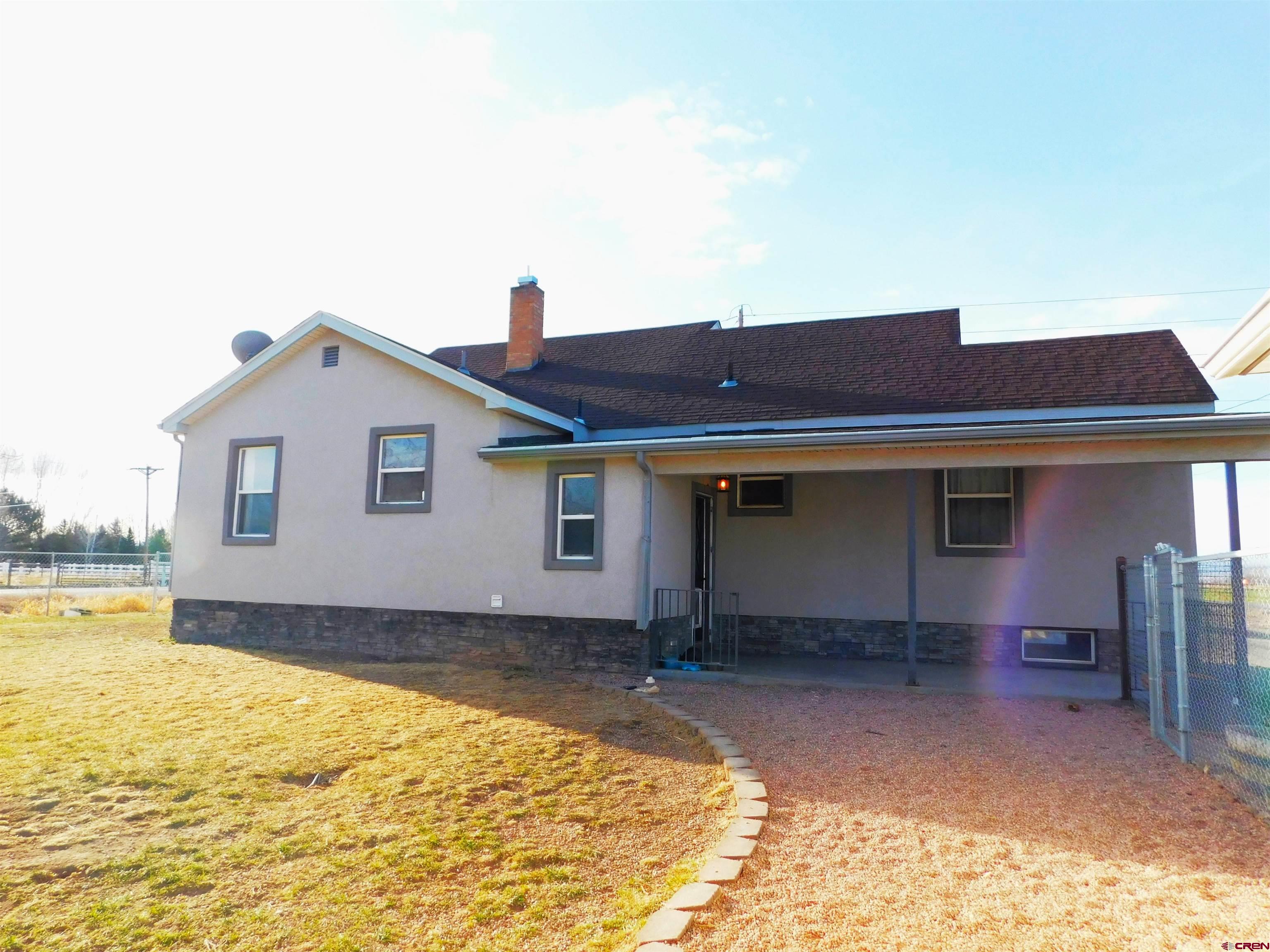 14977 F Road Delta, CO 81416 - Photo 38 of 45 Lovely nice sized covered back porch, North facing patio that stays cool and gets a nice breeze in summer!!