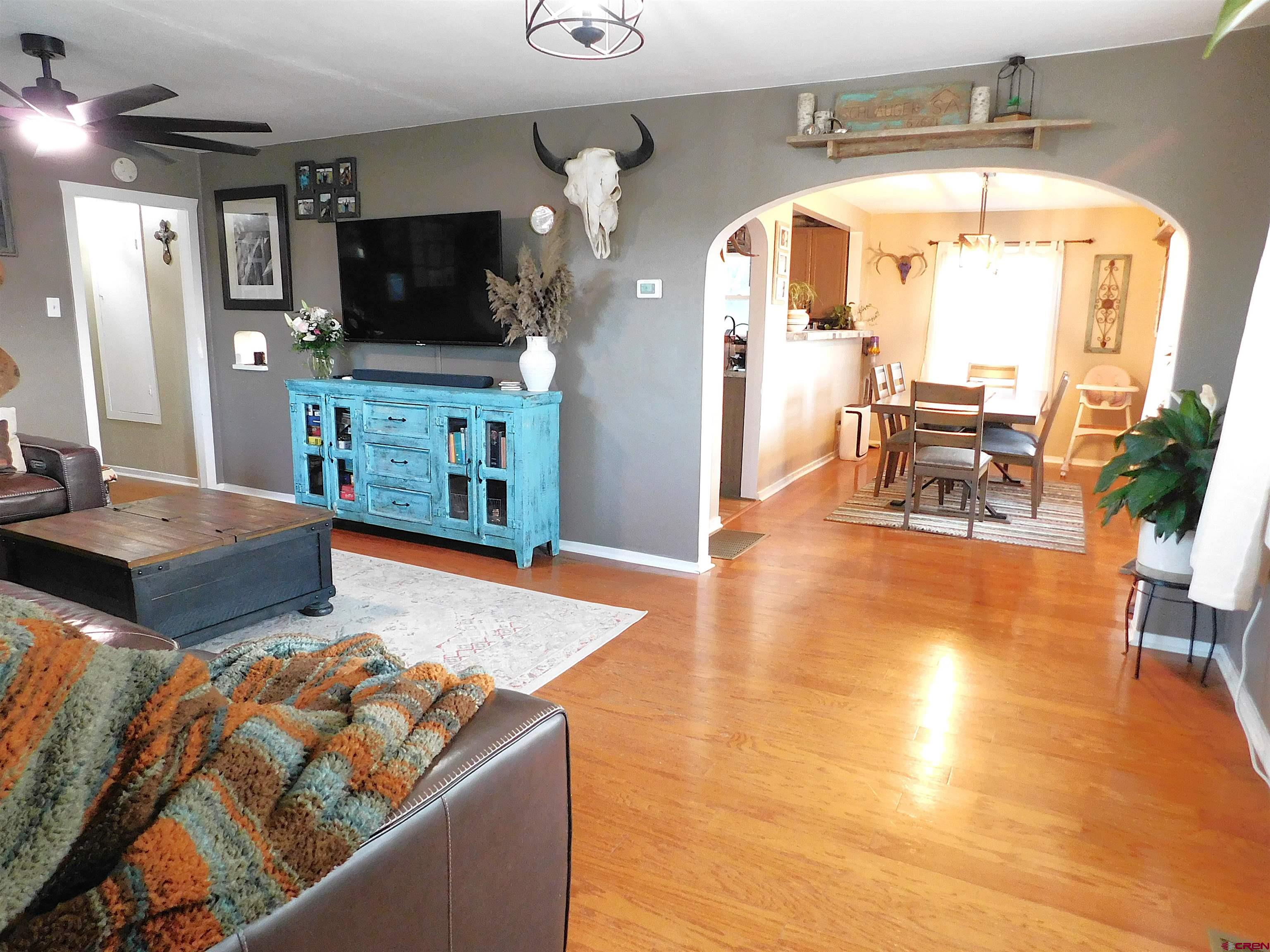 14977 F Road Delta, CO 81416 - Photo 4 of 45 a living room with furniture and a flat screen tv