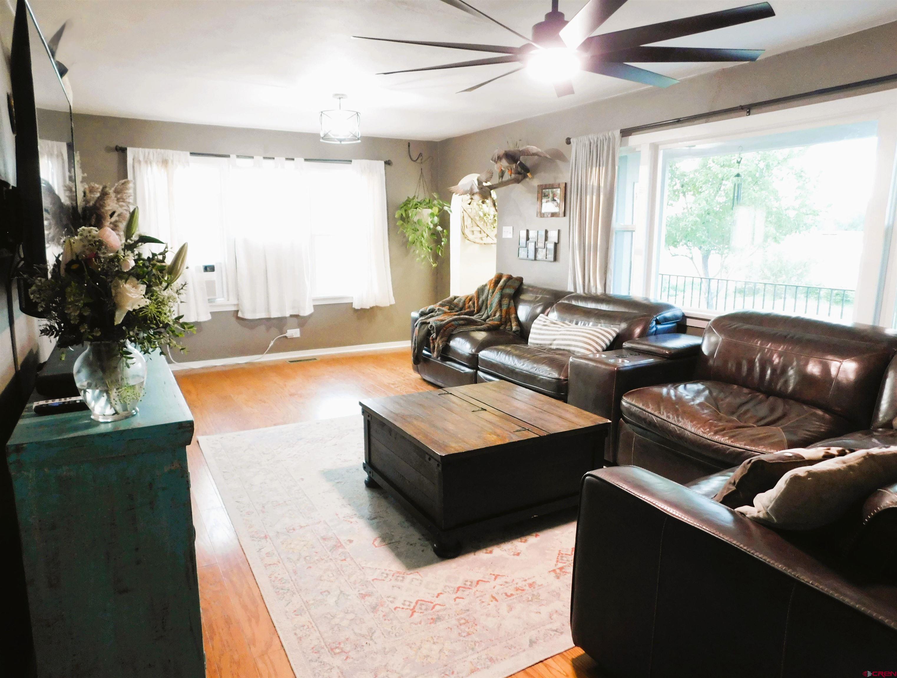 14977 F Road Delta, CO 81416 - Photo 7 of 45 a living room with furniture and a large window