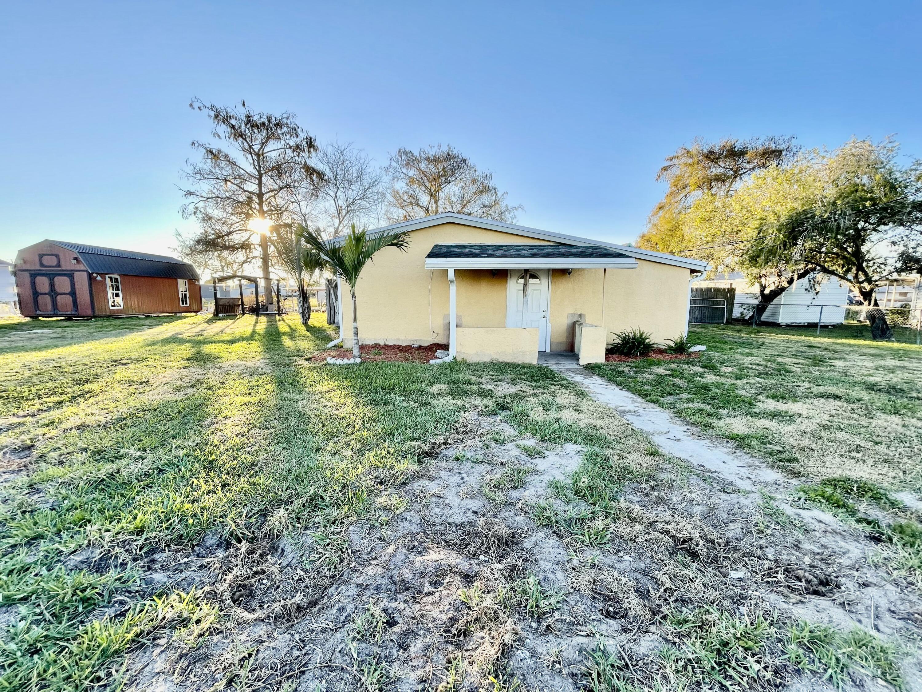 1498 Hunter Road Okeechobee, FL 34974 - Photo 1 of 47 61B96D5D-5695-46BE-86AF-D66721BBA55F_1_2