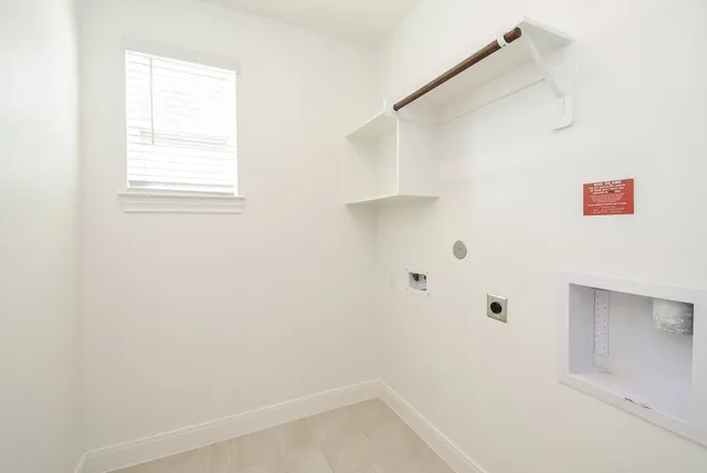 a view of a kitchen with kitchen island a sink wooden floor and a refrigerator