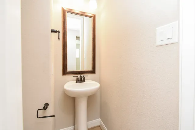 a large kitchen with granite countertop a large counter top stainless steel appliances and cabinets