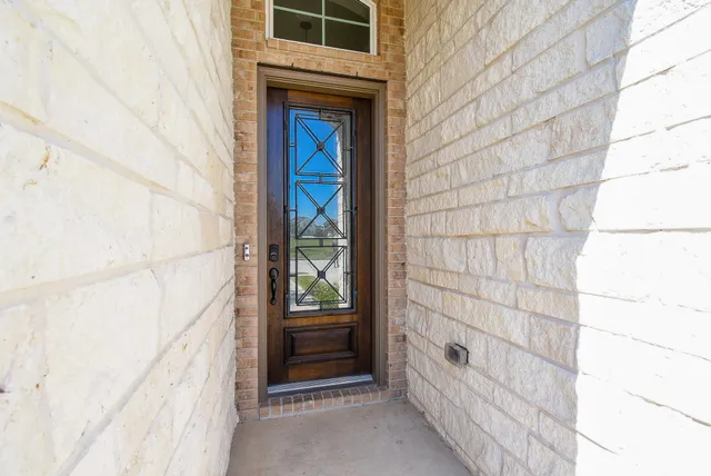 an empty room that has a window in it