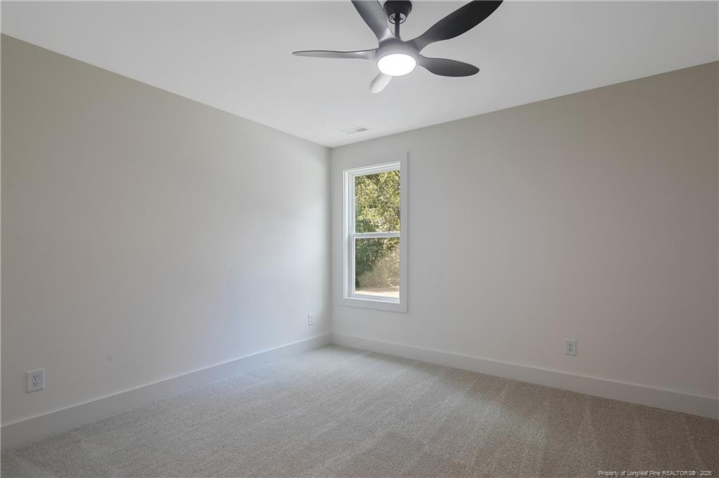 4728 Butler Nursery Road Fayetteville, NC 28306 - Photo 34 of 49 an empty room with a window and a fan
