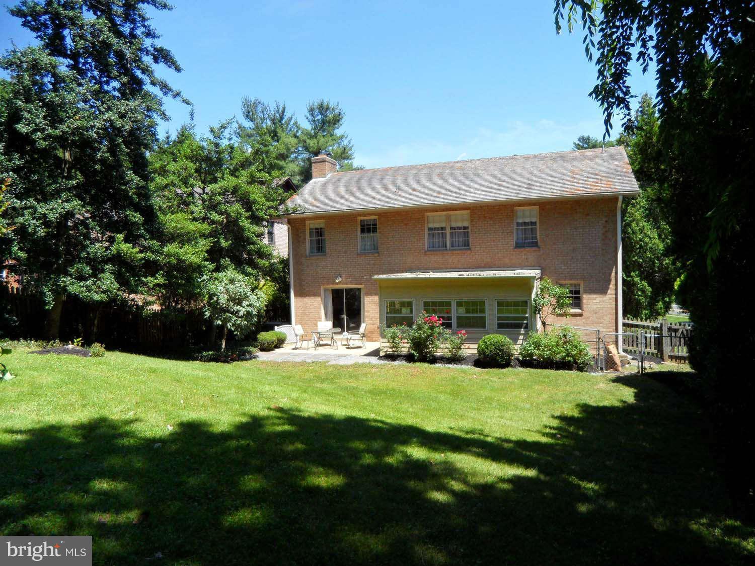 5908 Walhonding Road Bethesda, MD 20816 - Photo 23 of 26 a view of house with yard and green space