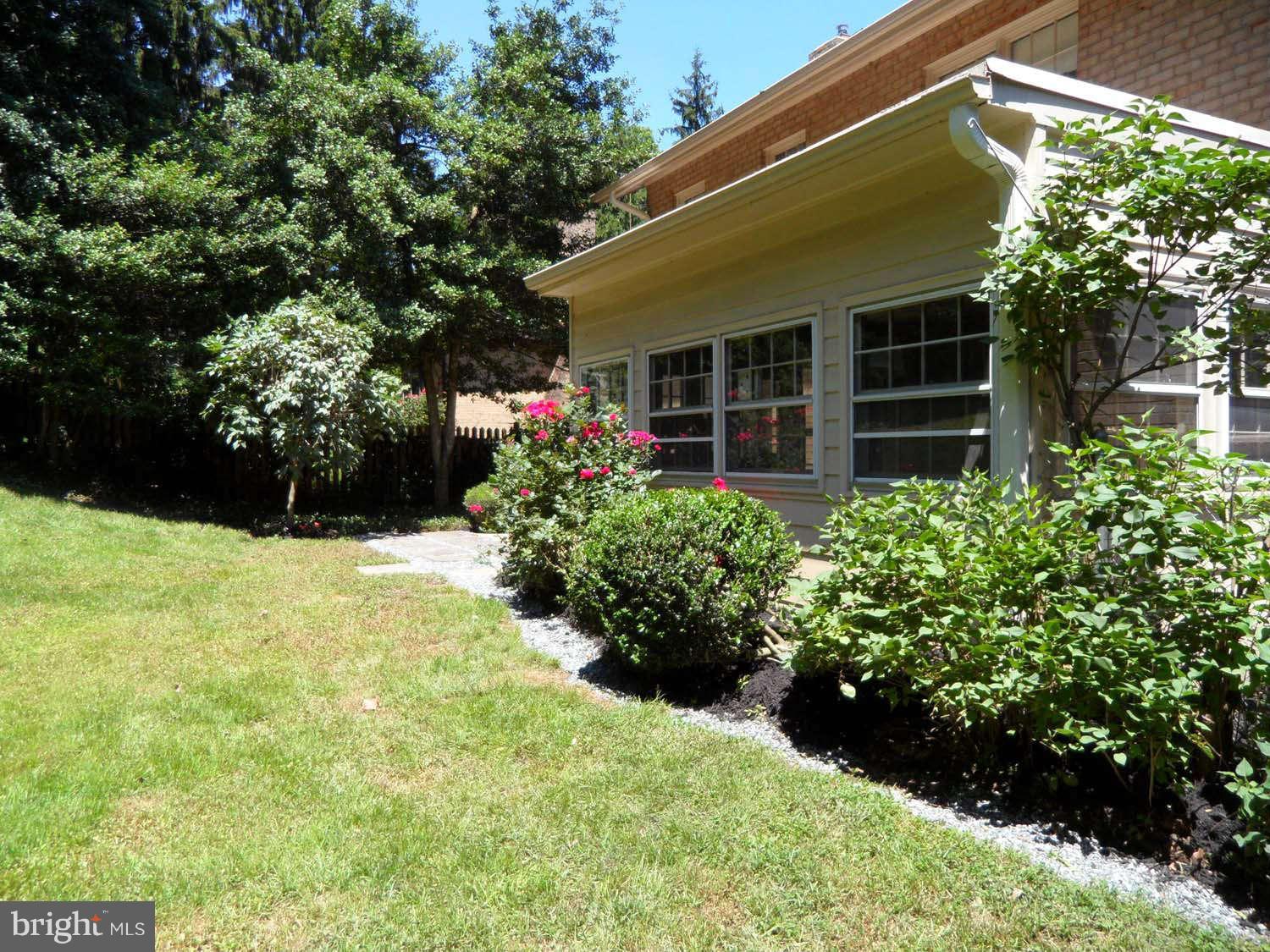 5908 Walhonding Road Bethesda, MD 20816 - Photo 24 of 26 a view of a house with a garden