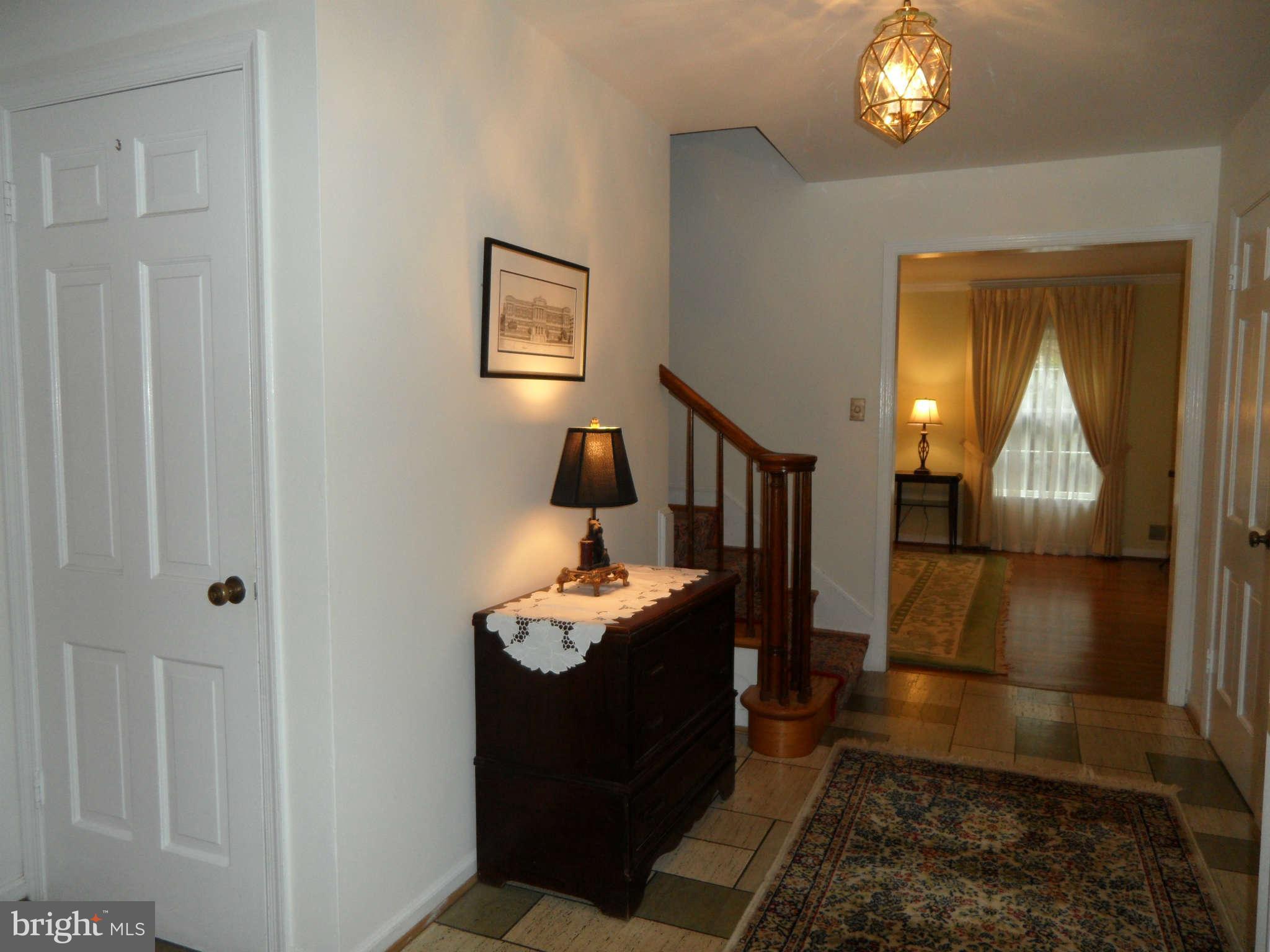 5908 Walhonding Road Bethesda, MD 20816 - Photo 4 of 26 a living room with furniture and a wooden floor