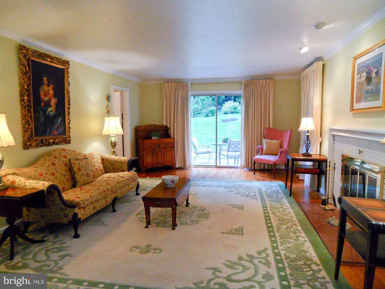 5908 Walhonding Road Bethesda, MD 20816 - Photo 5 of 26 a living room with furniture and a window