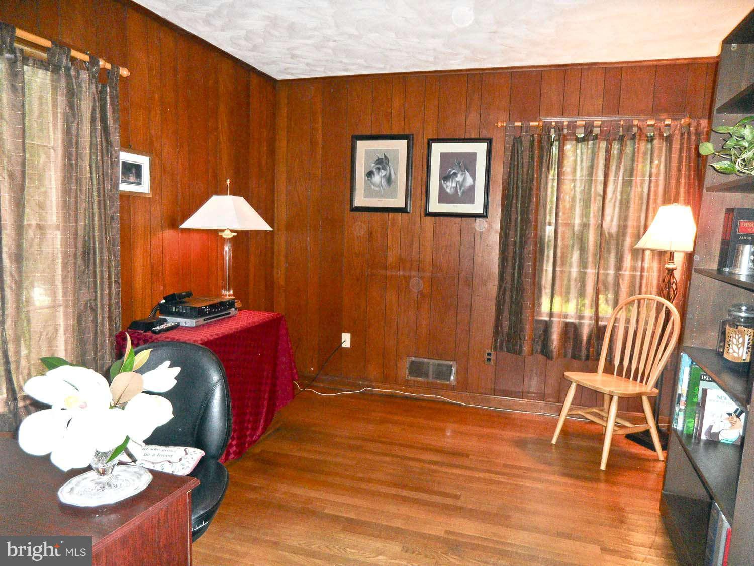 5908 Walhonding Road Bethesda, MD 20816 - Photo 9 of 26 a room with furniture and wooden floor