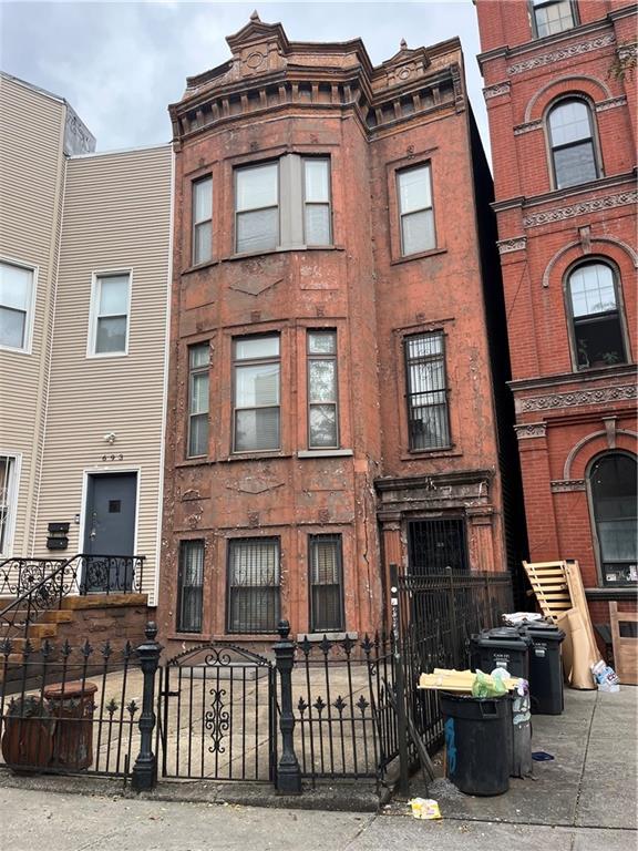 695 Bushwick Avenue Brooklyn, NY 11221 - Photo 1 of 1 a front view of a building with many windows