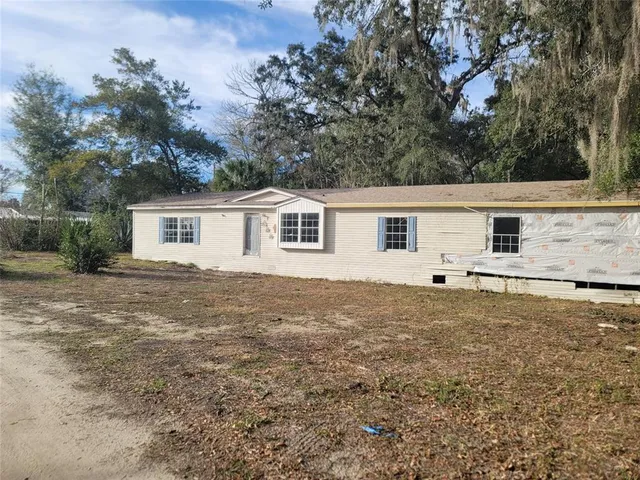 a house view with a backyard space