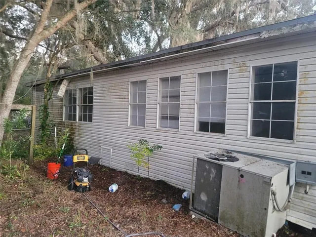 a view of a house with a yard and a garage