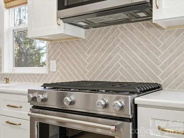 a bathroom with a sink and a window