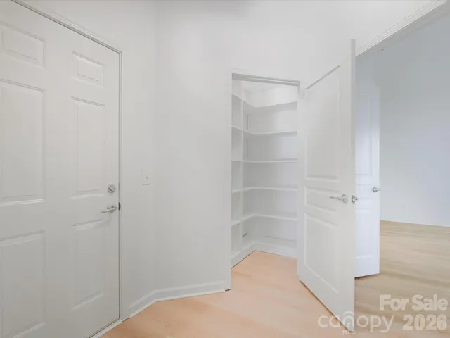 a bathroom with a double vanity sink toilet mirror and shower
