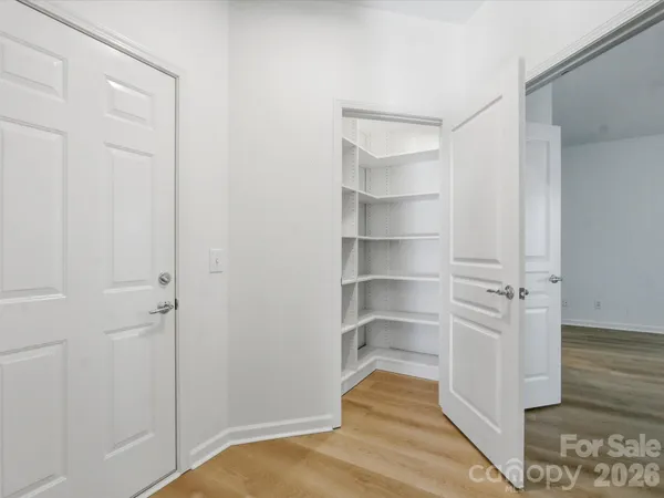 a bathroom with a double vanity sink toilet mirror and shower
