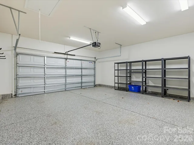 a view of a livingroom with furniture and a ceiling fan